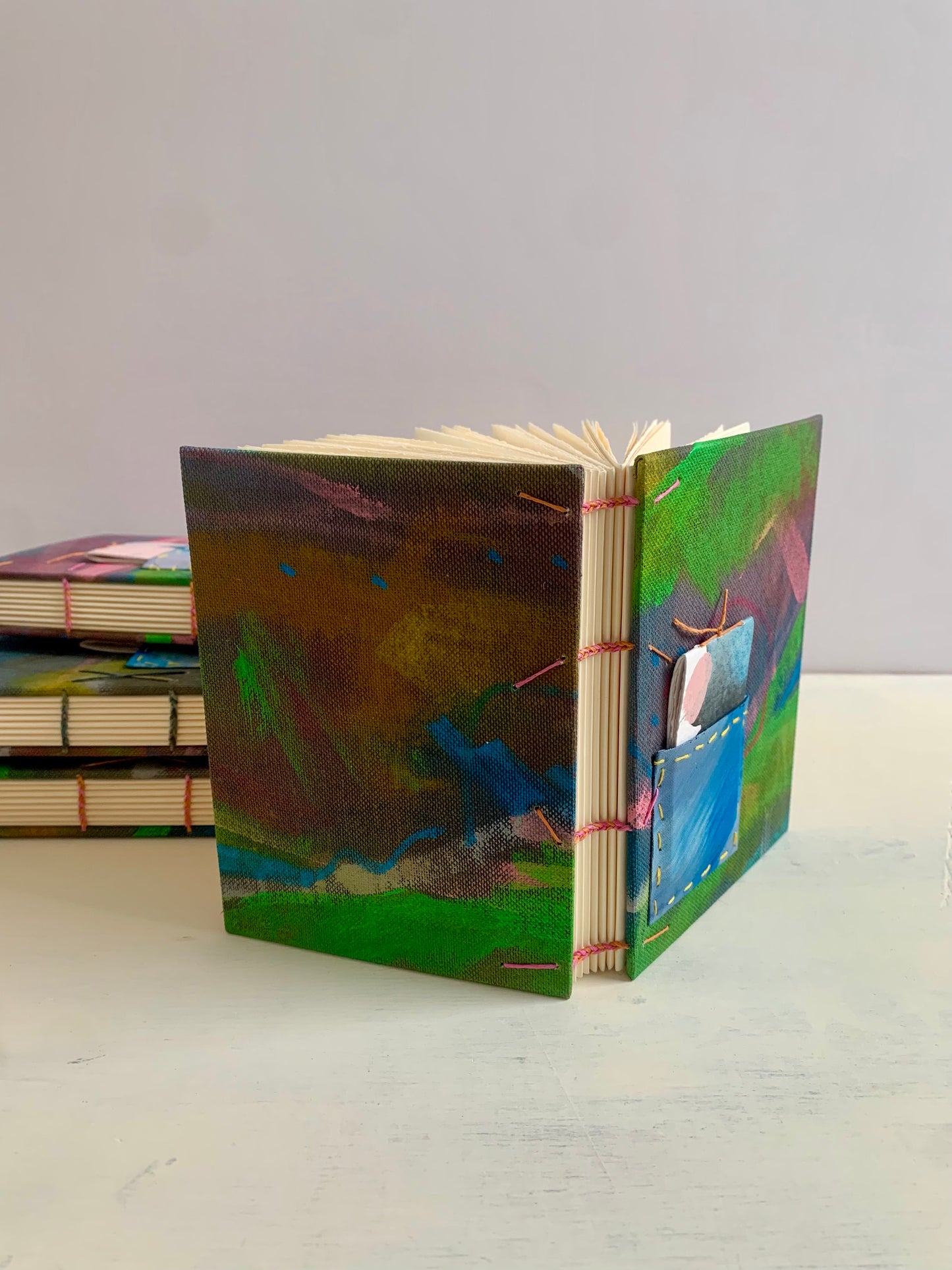 Journal or sketchbook with fun hand painted covers and brightly coloured binding A6