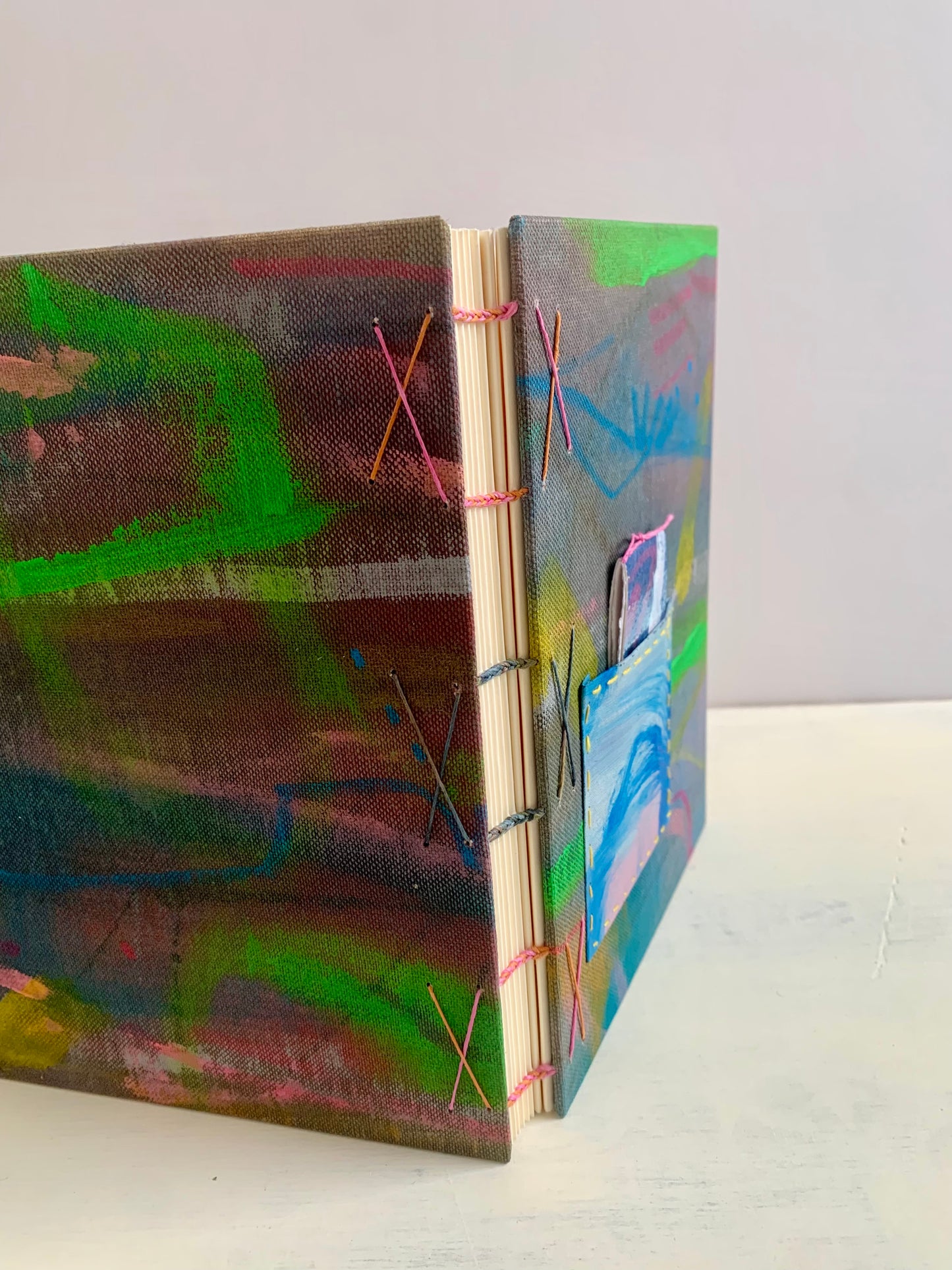 Journal or sketchbook with fun hand painted covers and brightly coloured binding A5