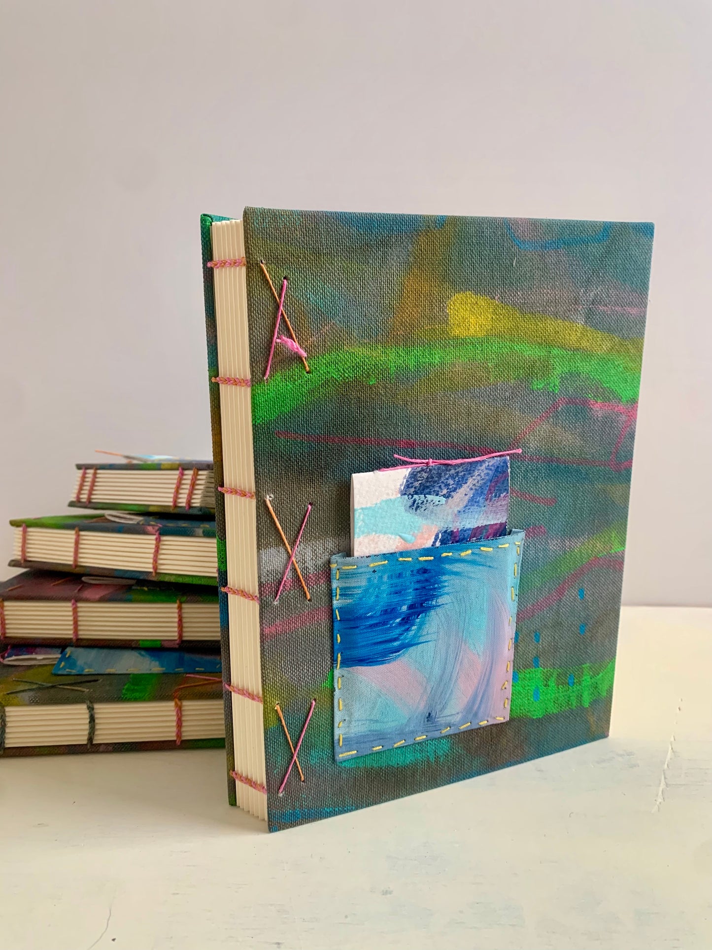 Journal or sketchbook with fun hand painted covers and brightly coloured binding A5